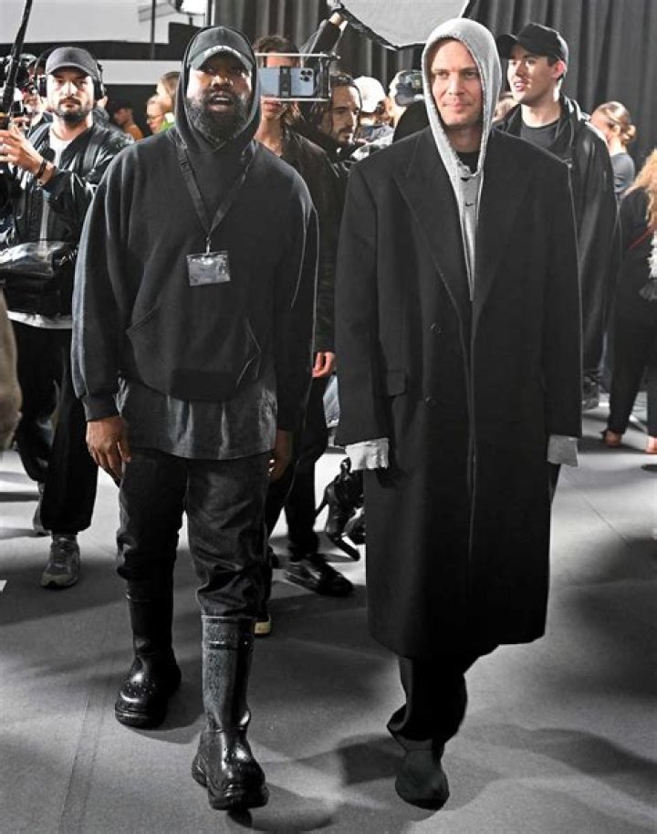 
Kanye West Steps Out at Burberry Show in Bedazzled Flip Flops and Socks: ‘Don’t Talk to Me’ 